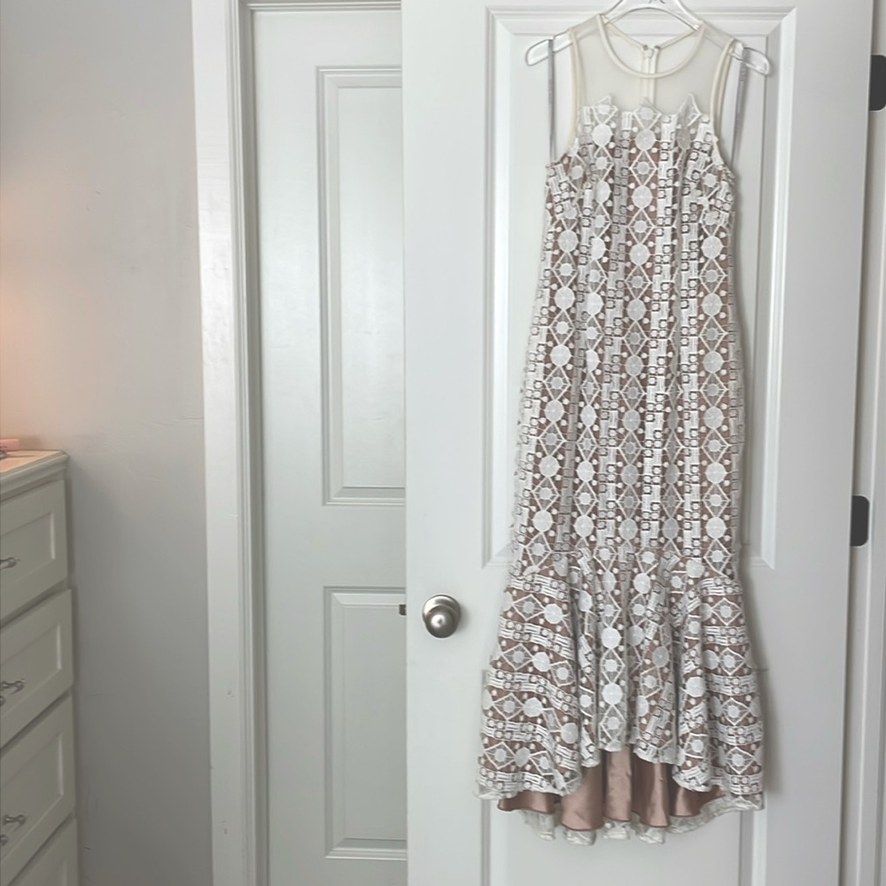 Mikael Aghal size 2, lace dress with sick inside lining.